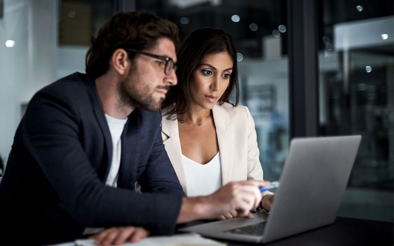 Teammates managing data across multiple environments, using Veritas solutions.