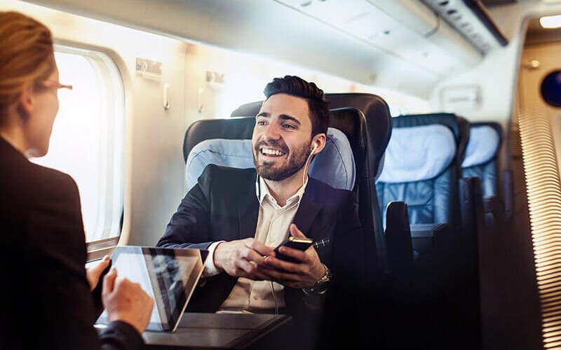 Business professionals have discussion on train