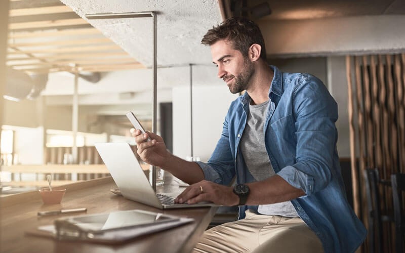 Businessman is able to work anywhere with different devices