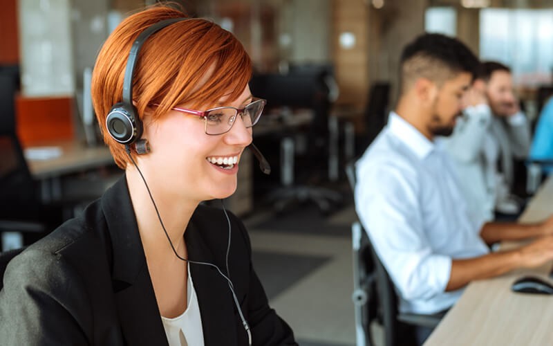 Service desk employee reviewing support tickets