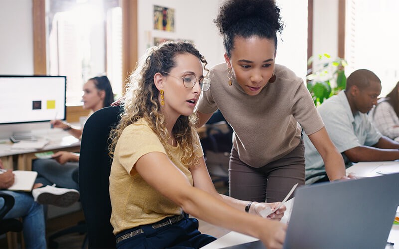 Smiling woman on talking with colleague 