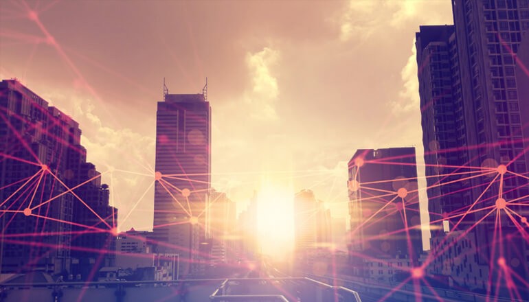 Image of city at sunset with graphics