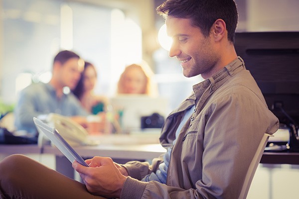Male using tablet to do business