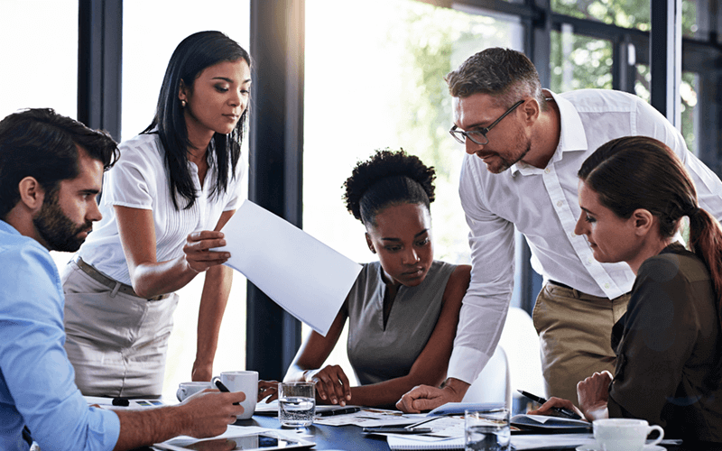 Group of business professionals work collaboratively on IT strategy