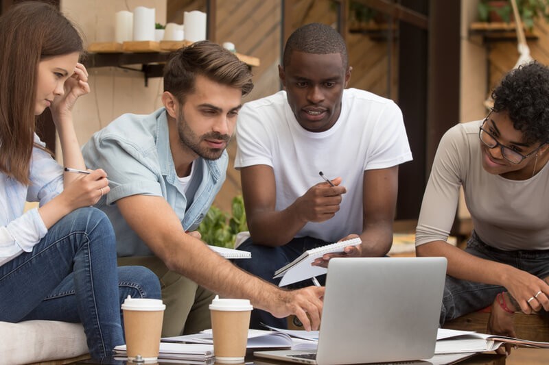 group of business colleagues use mobile device 
