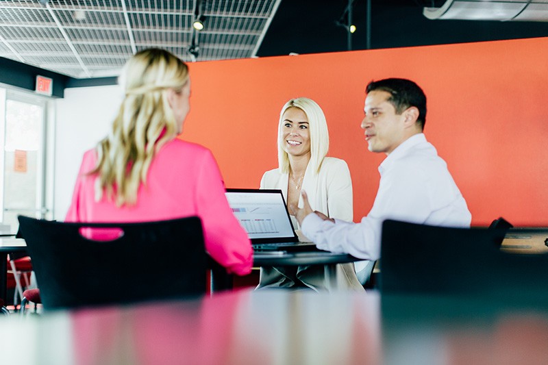 Business professionals discuss work challenges 